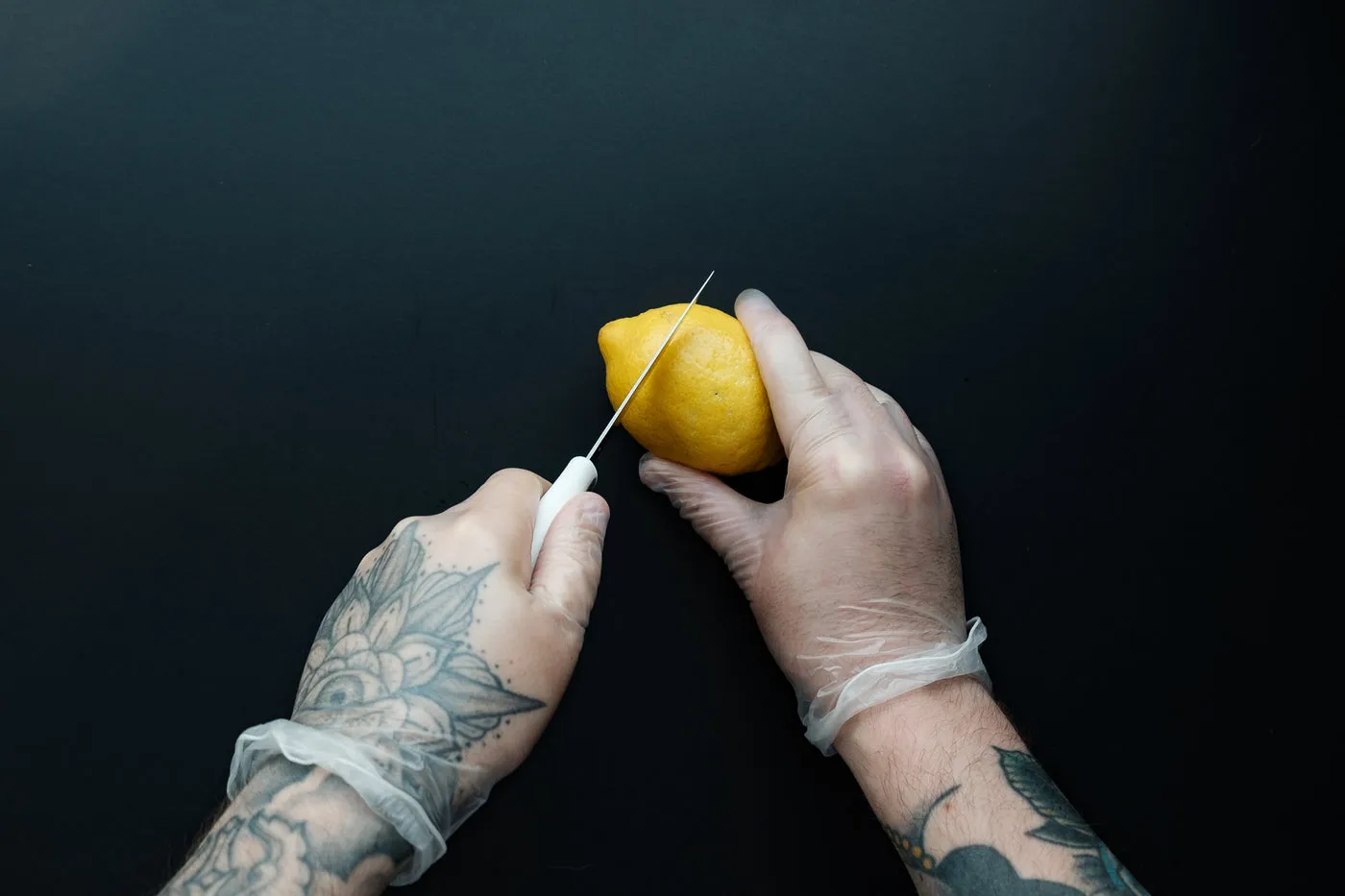 Man With Tattooed Hands Prepping Food
