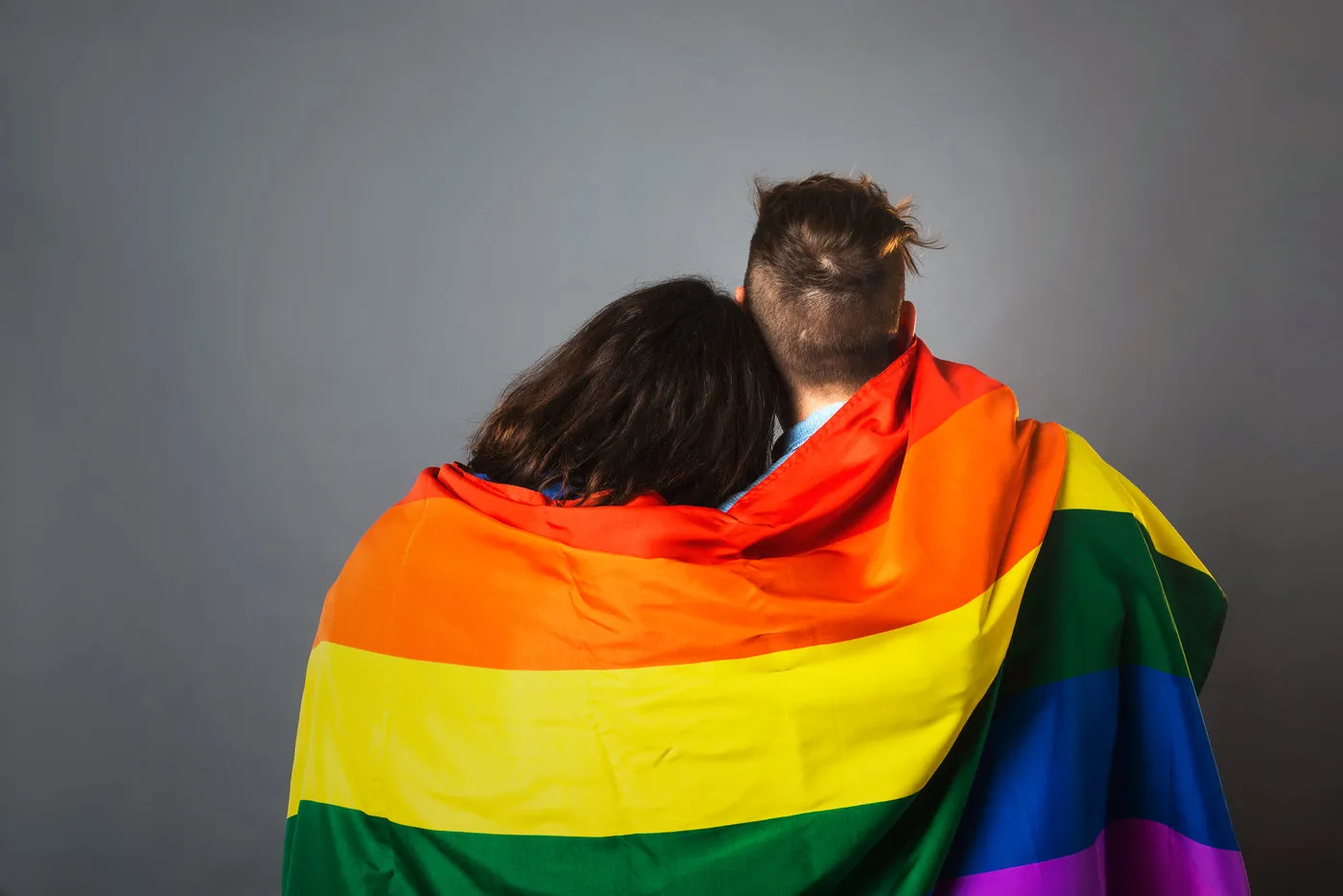 Couple Wrapped In Pride Flag